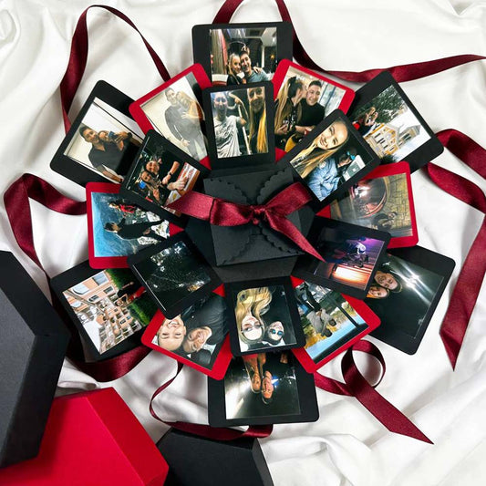 Geschenkbox mit explodierender Bilderwand