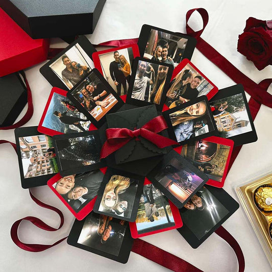 Geschenkbox mit explodierender Bilderwand