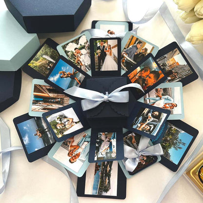 Geschenkbox mit explodierender Bilderwand